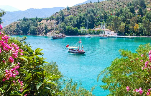 Gulet yachts anchored in a sheltered cove in Turkey
